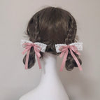 A pair of pink scrunchies