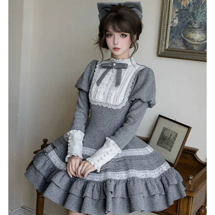 Two - piece Lolita dresses with capes, ruffled tiers and cute bowknots for a charming look