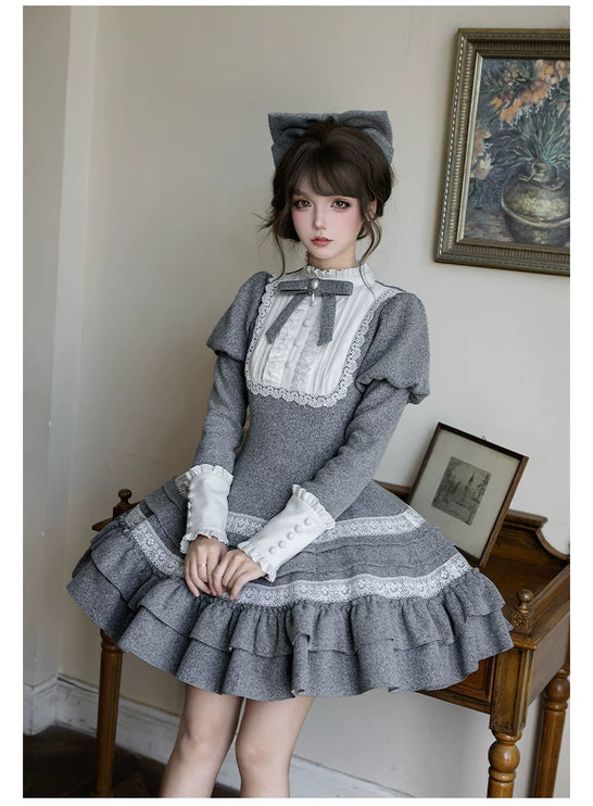 Two - piece Lolita dresses with capes, ruffled tiers and cute bowknots for a charming look