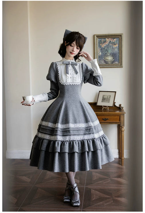 Two - piece Lolita dresses with capes, ruffled tiers and cute bowknots for a charming look