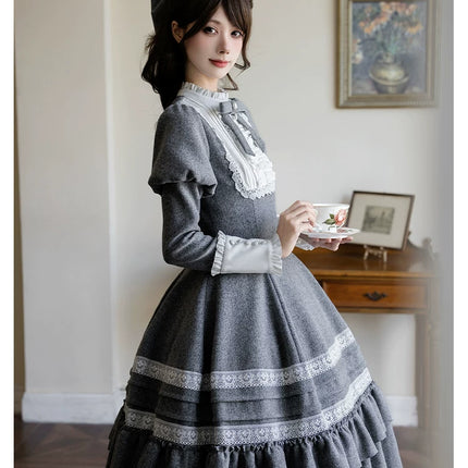 Two - piece Lolita dresses with capes, ruffled tiers and cute bowknots for a charming look