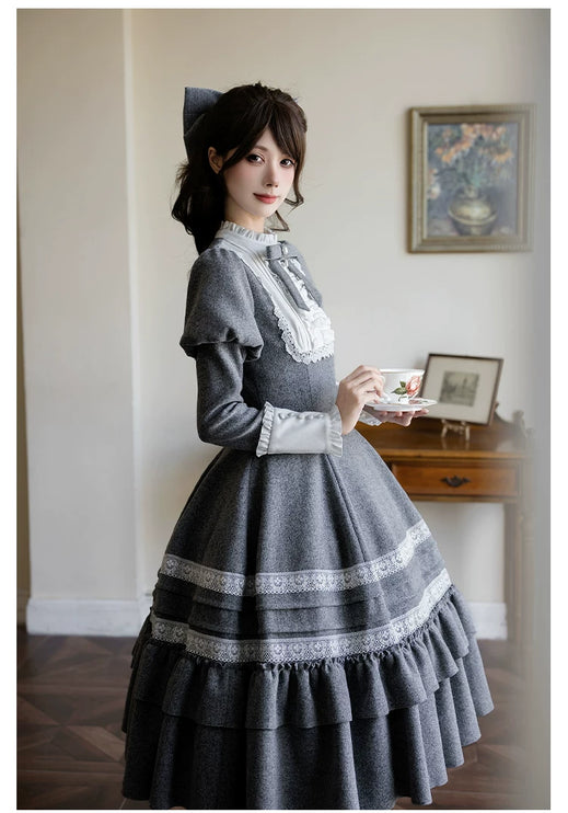 Two - piece Lolita dresses with capes, ruffled tiers and cute bowknots for a charming look